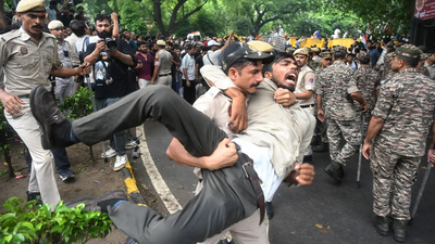 police-personnel-detain-protesters-during-the-protest-march-against-the-alleged-neet-paper-leak-from-jantar-mantar-to-parliament.jpg