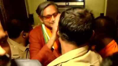 shashi-tharoor-being-brought-out-of-the-lift.jpg